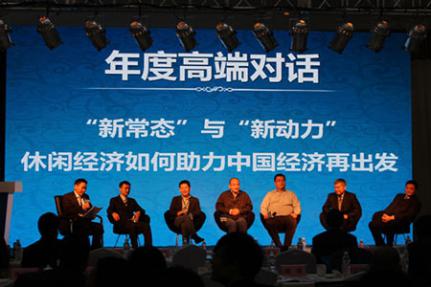 7 people seated in front of a large backdrop with large Chinese lettering